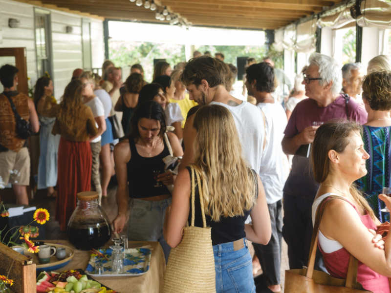 People standing undercover on a verandah